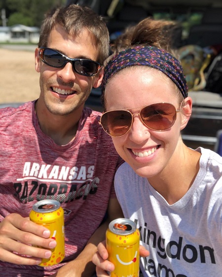 Jill Duggar with husband Derick Dillard holding sodas.